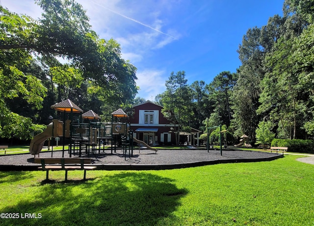 community jungle gym with a yard