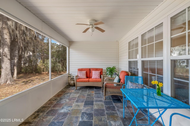 sunroom / solarium with wooden ceiling and ceiling fan