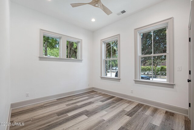 1411 Duke St, Beaufort, SC 29902 - empty room featuring light wood-style flooring, ceiling fan, and recessed lighting