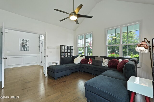 36 Hopper Ridge Rd, Okatie, SC 29909 - living room featuring ceiling fan, hardwood / wood-style floors, high vaulted ceiling, wainscoting, and a decorative wall