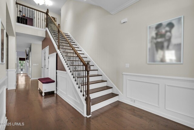 36 Hopper Ridge Rd, Okatie, SC 29909 - staircase with hardwood / wood-style flooring, crown molding, a decorative wall, and a high ceiling