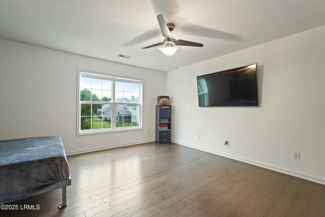 36 Hopper Ridge Rd, Okatie, SC 29909 - bedroom featuring baseboards, hardwood / wood-style floors, and a ceiling fan