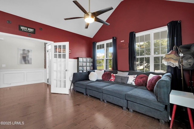 living room featuring wainscoting, ceiling fan, french doors, and plenty of natural light