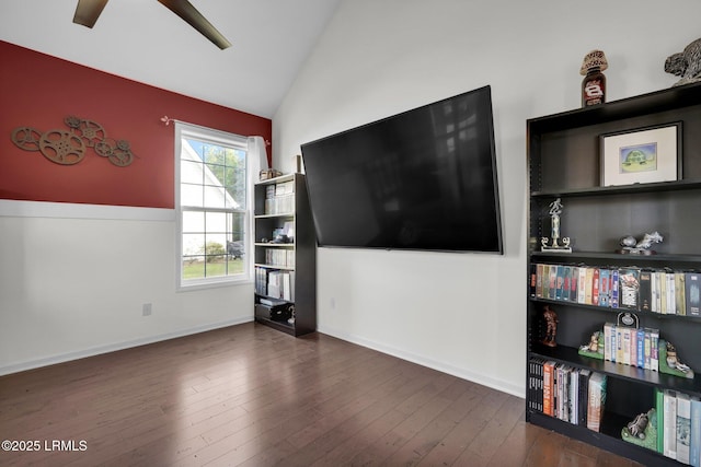 unfurnished living room featuring baseboards, wood finished floors, a ceiling fan, and lofted ceiling