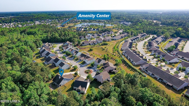 aerial view featuring a residential view and a forest view