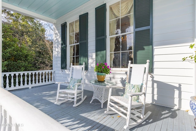 wooden terrace featuring a porch