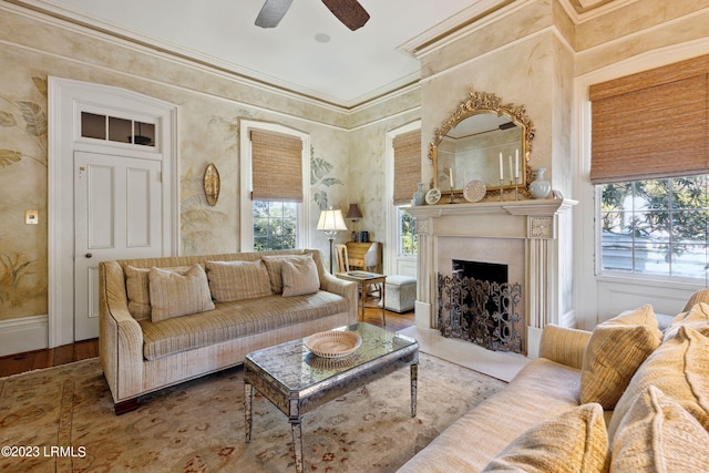 living room featuring crown molding, ceiling fan, and hardwood / wood-style flooring