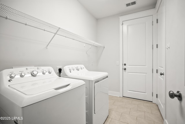 135 Danbridge Ct, Bluffton, SC 29910 - laundry room featuring washing machine and clothes dryer and light tile patterned floors