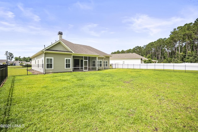 135 Danbridge Ct, Bluffton, SC 29910 - back of property with a sunroom, a fenced backyard, a chimney, and a shingled roof