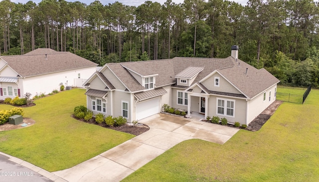 135 Danbridge Ct, Bluffton, SC 29910 - craftsman-style home featuring driveway, a chimney, roof with shingles, an attached garage, and a forest view