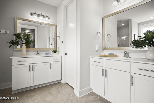 135 Danbridge Ct, Bluffton, SC 29910 - bathroom featuring two vanities, a stall shower, and tile patterned floors