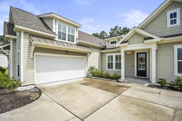 135 Danbridge Ct, Bluffton, SC 29910 - view of front of house with roof with shingles, driveway, a standing seam roof, a metal roof, and an attached garage
