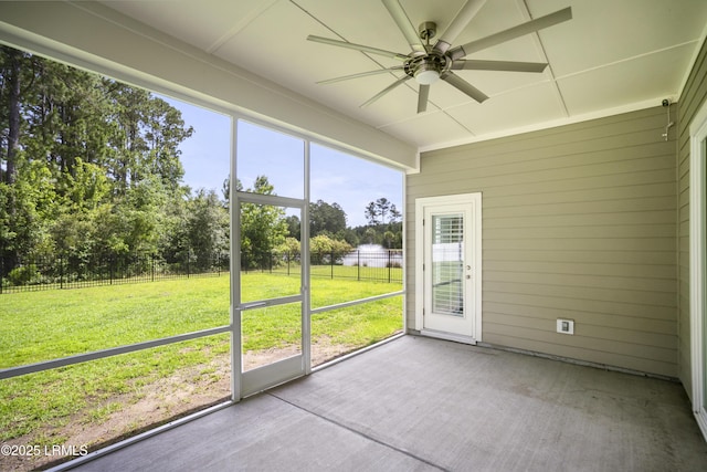 135 Danbridge Ct, Bluffton, SC 29910 - unfurnished sunroom featuring ceiling fan, view of scattered trees, and a water view