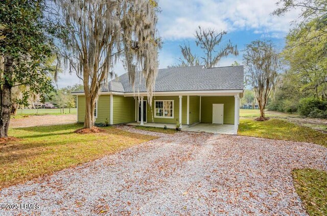 exterior space with a carport