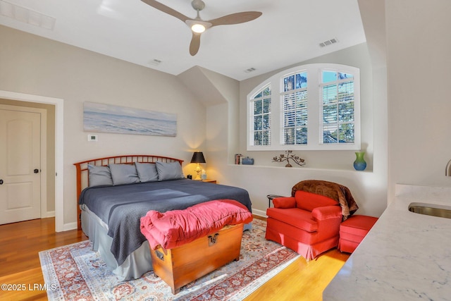 bedroom featuring hardwood / wood-style floors and ceiling fan