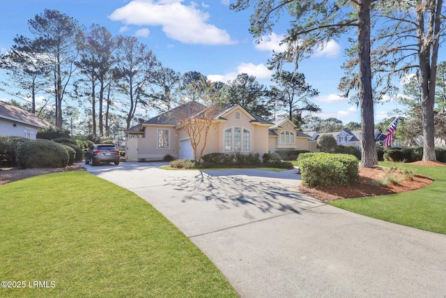 view of front of house featuring a garage and a front lawn