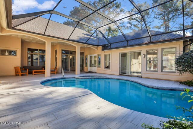 view of pool with a lanai and a patio