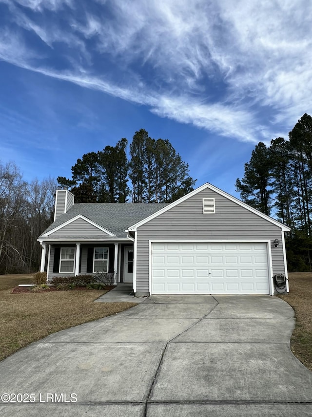 ranch-style house with a garage and a front yard