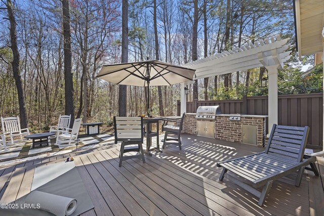 625 Spanish Wells Rd Unit 12, Hilton Head Island, SC 29926 - wooden deck featuring fence, outdoor dining space, and area for grilling