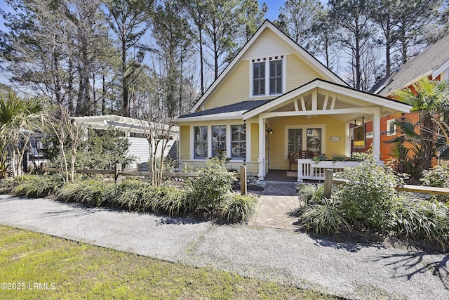 625 Spanish Wells Rd Unit 12, Hilton Head Island, SC 29926 - view of front of house featuring roof with shingles, a pergola, and covered porch