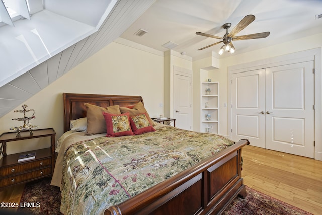 625 Spanish Wells Rd Unit 12, Hilton Head Island, SC 29926 - bedroom with visible vents, light wood finished floors, lofted ceiling, and a closet