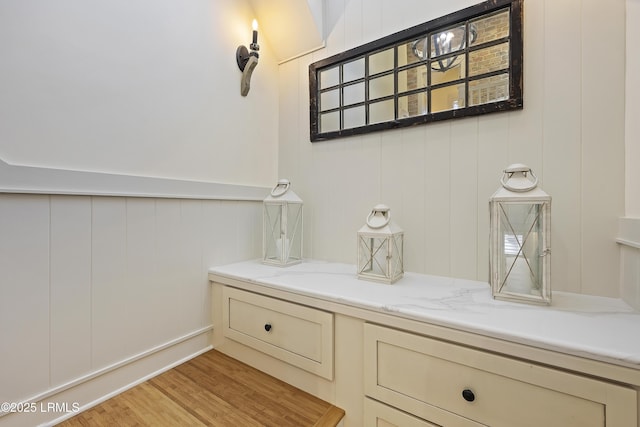 625 Spanish Wells Rd Unit 12, Hilton Head Island, SC 29926 - bathroom featuring a decorative wall and wood finished floors