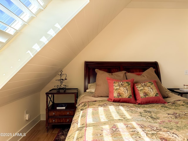 625 Spanish Wells Rd Unit 12, Hilton Head Island, SC 29926 - bedroom featuring baseboards, vaulted ceiling, and wood finished floors