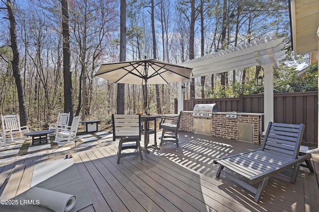625 Spanish Wells Rd Unit 12, Hilton Head Island, SC 29926 - wooden terrace featuring area for grilling, exterior kitchen, and outdoor dining space