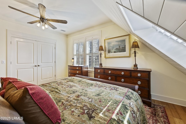625 Spanish Wells Rd Unit 12, Hilton Head Island, SC 29926 - bedroom featuring visible vents, a closet, wood finished floors, baseboards, and vaulted ceiling