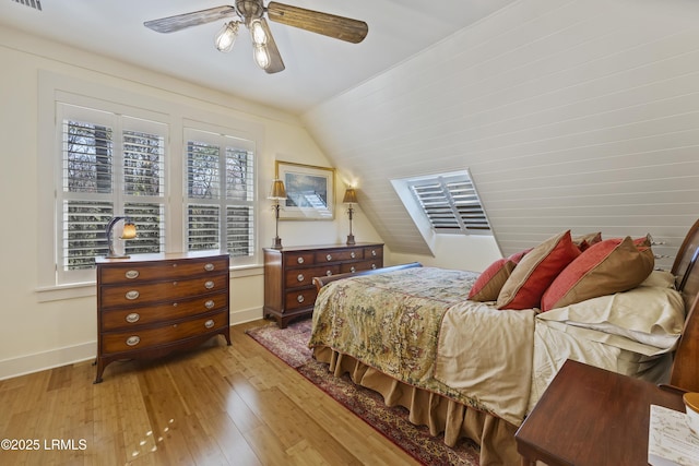625 Spanish Wells Rd Unit 12, Hilton Head Island, SC 29926 - bedroom with wood-type flooring, baseboards, vaulted ceiling, and visible vents