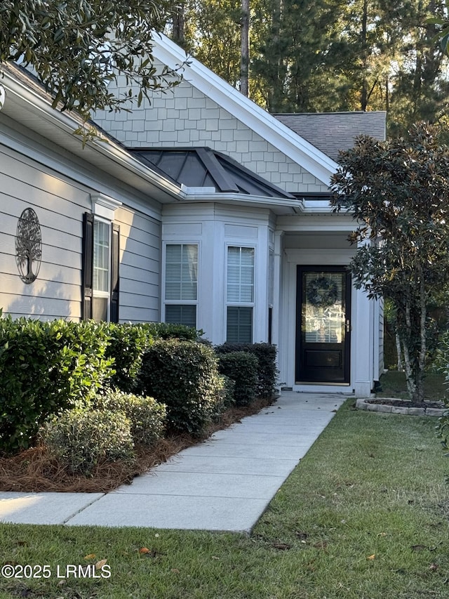 659 Mystic Point Dr, Okatie, SC 29909 - property entrance with a shingled roof and a yard