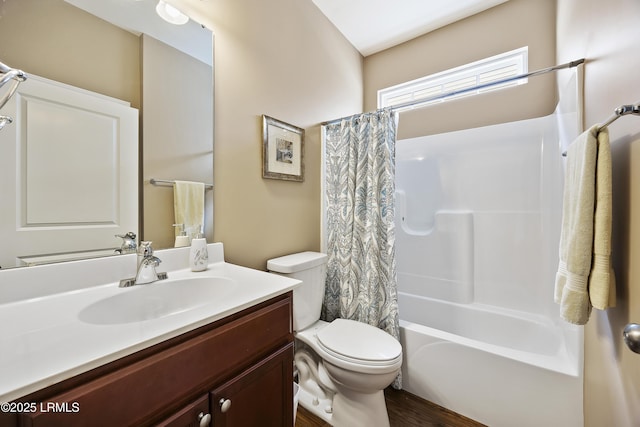 full bathroom with toilet, vanity, and shower / bathtub combination with curtain