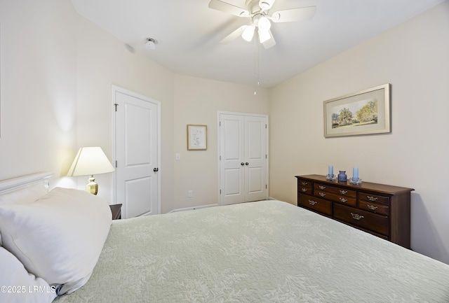 bedroom with ceiling fan and a closet