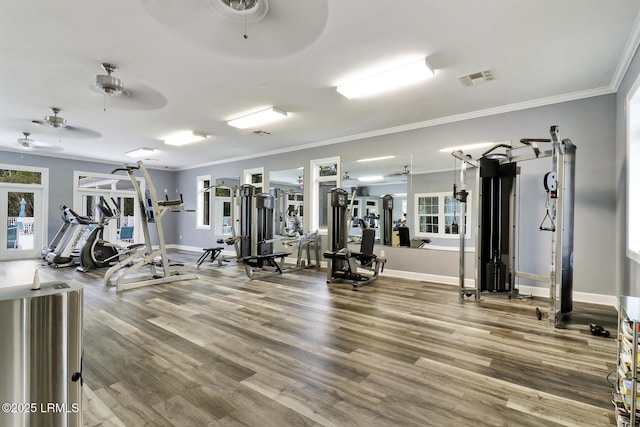 exercise room featuring crown molding, hardwood / wood-style floors, and ceiling fan