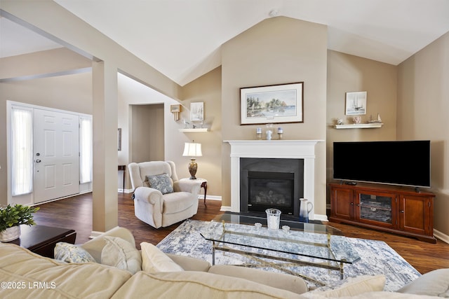 living room with vaulted ceiling and dark hardwood / wood-style floors