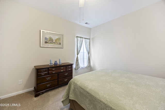 bedroom with light colored carpet