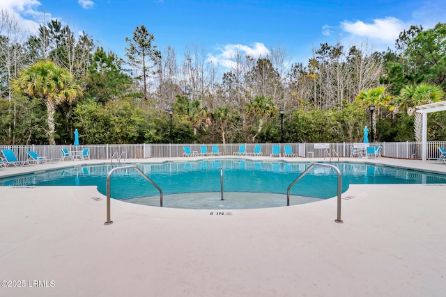 view of swimming pool featuring a patio area