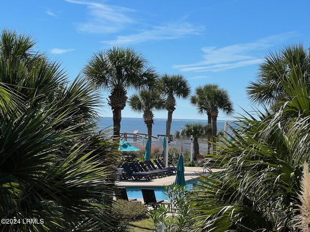 view of pool with a water view