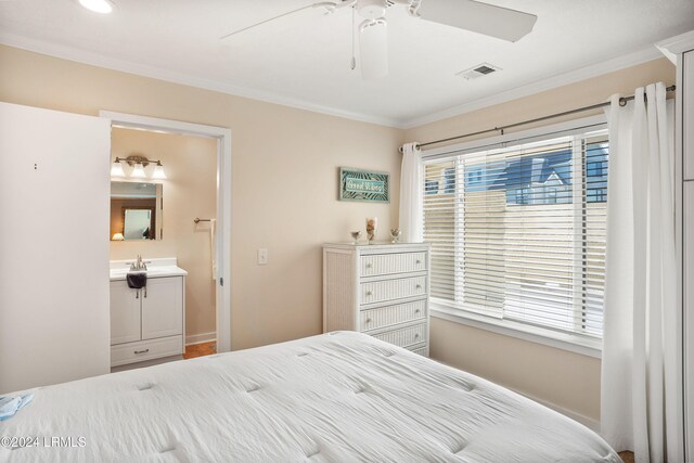 bedroom featuring crown molding, ceiling fan, connected bathroom, and sink