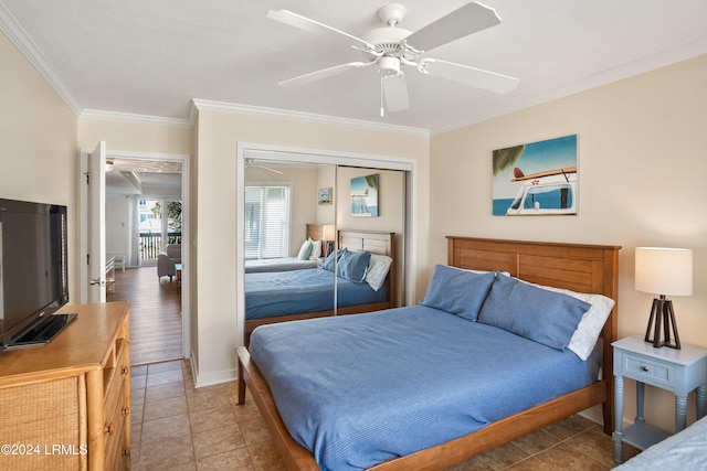 tiled bedroom featuring crown molding, ceiling fan, and a closet