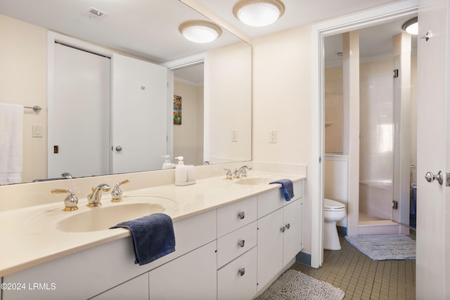 bathroom featuring walk in shower, vanity, tile patterned floors, and toilet