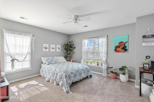 76 Shadow Moss Dr, Beaufort, SC 29906 - carpeted bedroom with ceiling fan, baseboards, and multiple windows