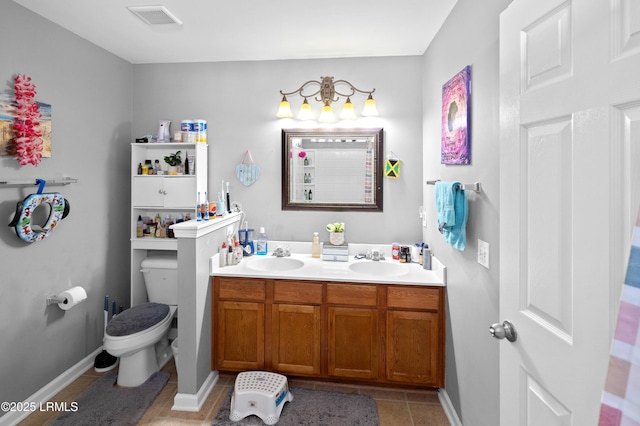 76 Shadow Moss Dr, Beaufort, SC 29906 - bathroom featuring toilet, tile patterned flooring, visible vents, and a sink