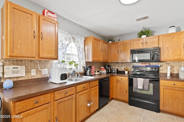 76 Shadow Moss Dr, Beaufort, SC 29906 - kitchen with a sink, dark countertops, visible vents, black appliances, and decorative backsplash