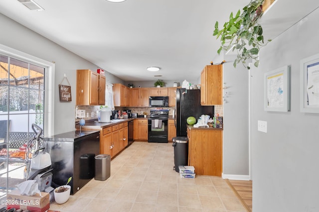 76 Shadow Moss Dr, Beaufort, SC 29906 - kitchen with black appliances, tasteful backsplash, visible vents, and plenty of natural light