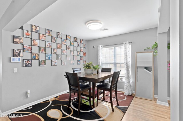 76 Shadow Moss Dr, Beaufort, SC 29906 - dining room featuring baseboards, visible vents, and wood finished floors