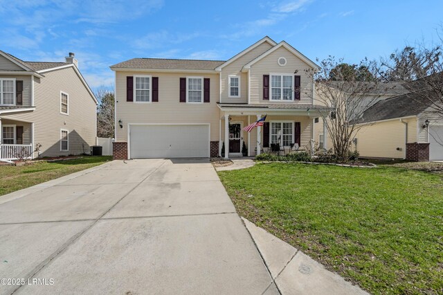 76 Shadow Moss Dr, Beaufort, SC 29906 - traditional home featuring a porch, an attached garage, brick siding, driveway, and a front lawn