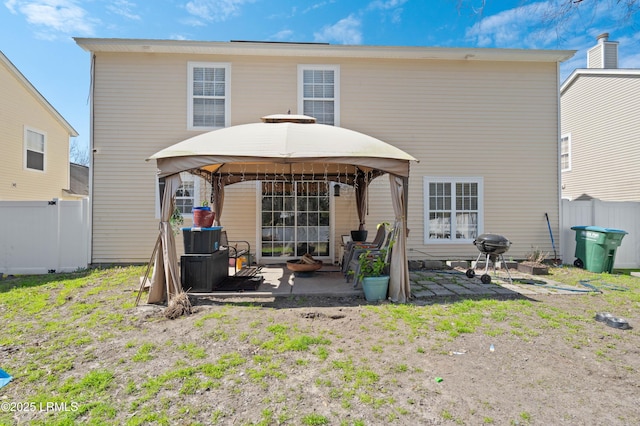 76 Shadow Moss Dr, Beaufort, SC 29906 - back of property with a gazebo, fence, and a patio