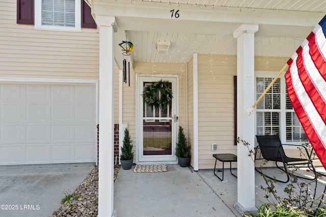 76 Shadow Moss Dr, Beaufort, SC 29906 - doorway to property with an attached garage and a porch