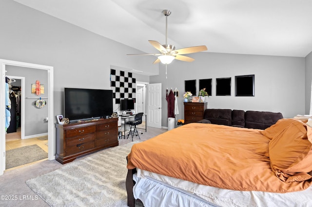 76 Shadow Moss Dr, Beaufort, SC 29906 - bedroom with a ceiling fan, high vaulted ceiling, a walk in closet, baseboards, and light colored carpet